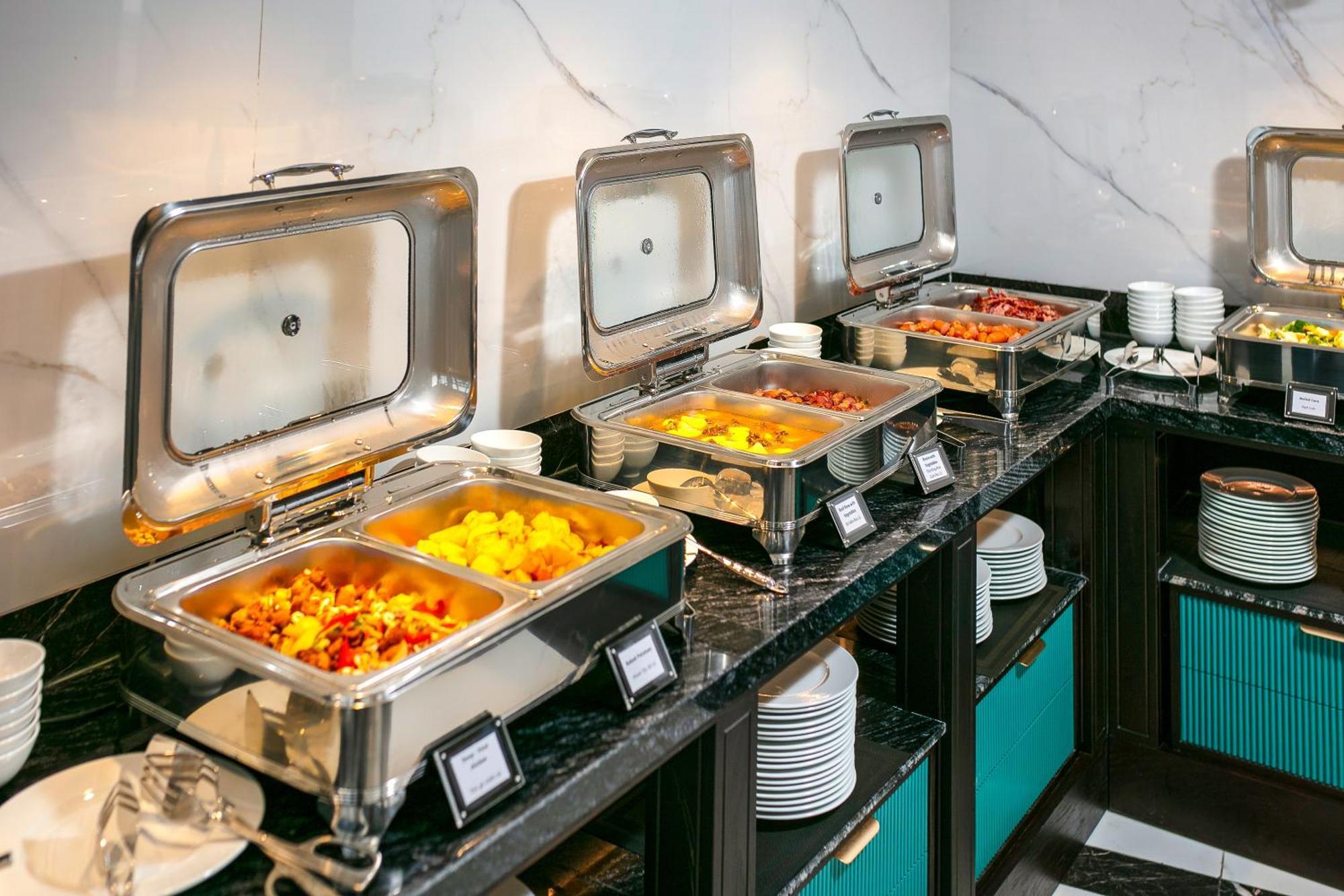 May De Ville Lakeside Hotel Hanoi Exterior photo A row of chafing dishes
